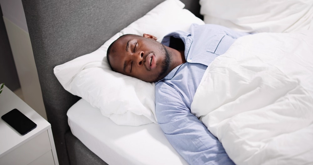 African,American,Man,With,Sleep,Apnea,Snoring 1765403596 1d075f3500aa45d5a0e7c170c5af2117 1
